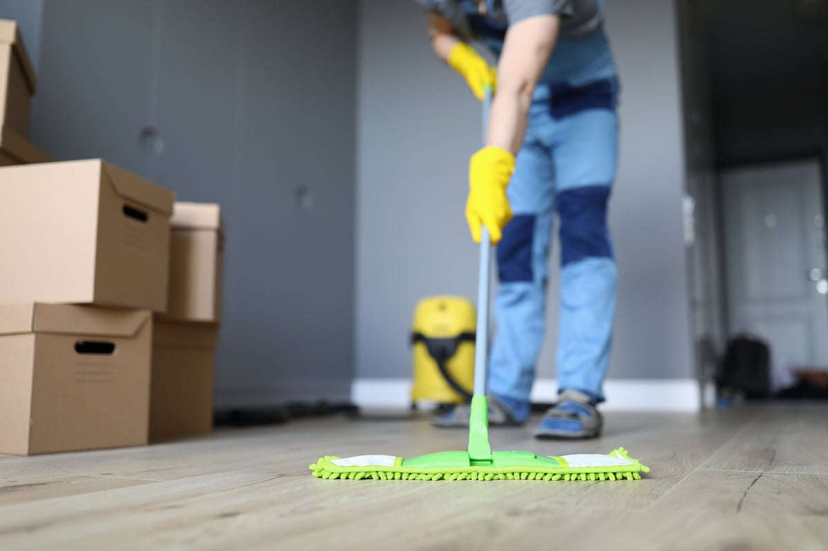 Professional cleaner deep cleaning the floors of a London home